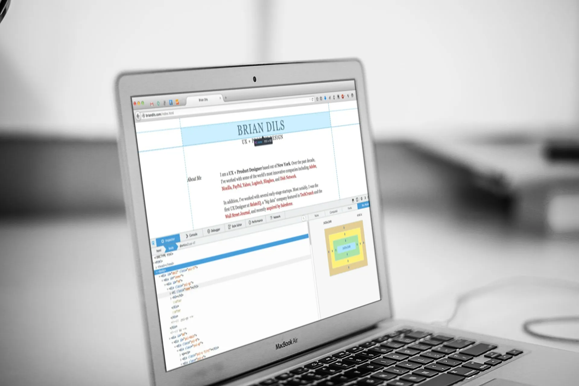 Laptop in black and white showing a web page in Firefox with the developer toolbox open below it, an HTML tree on the left and a box model diagram on the right.