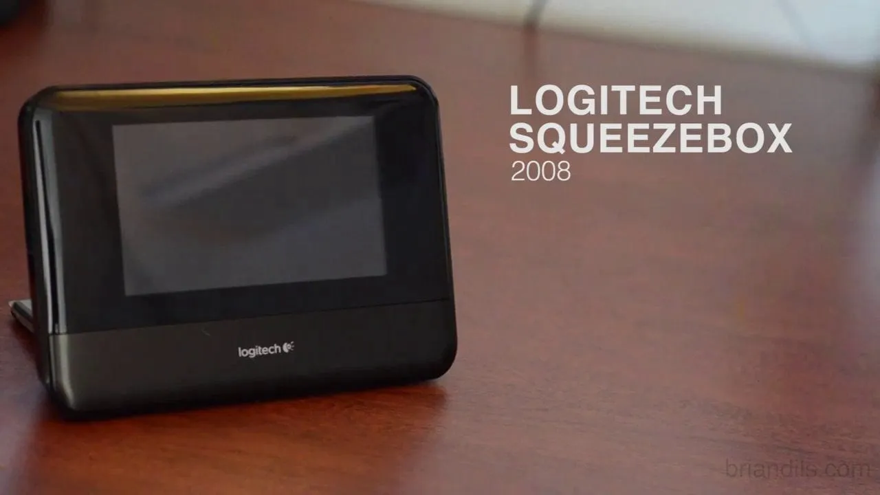 Title frame of the Squeezebox demo video: the Logitech Squeezebox Touch standing on a wooden table, with the product name set in white text beside it.